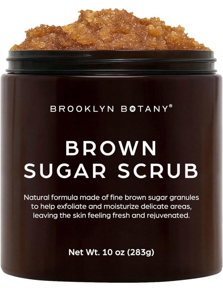 A close-up of the Brooklyn Botany Brown Sugar Body Scrub texture alongside fresh ingredients