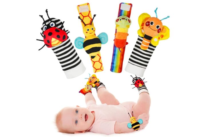 Baby wearing Infinno Baby Wrist Rattle Socks and Foot Finder sensory toy set