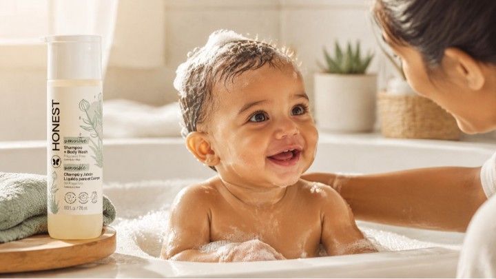Baby enjoying tear-free bath with gentle shampoo and body wash