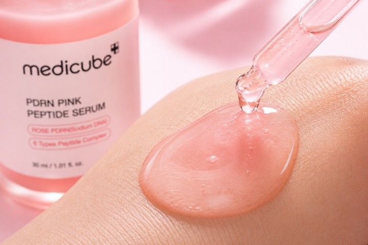 Close-up texture of medicube PDRN Pink Peptide Serum on skin