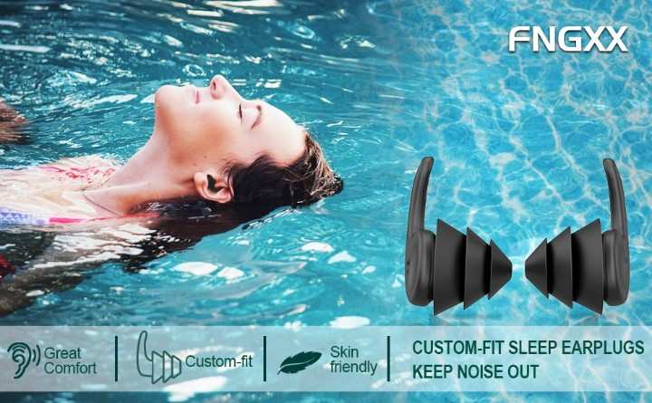 Adult swimmer using silicone ear plugs during lap swimming
